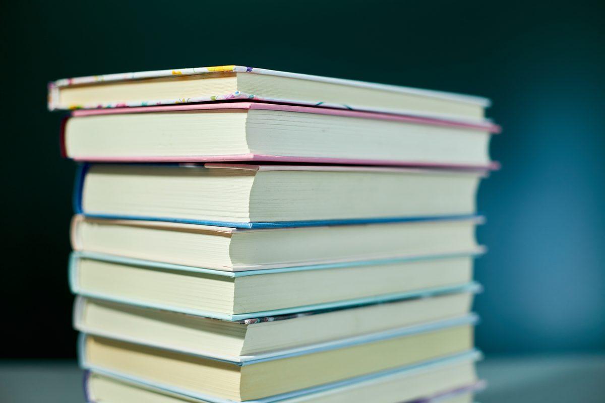 Tall stack of academic books